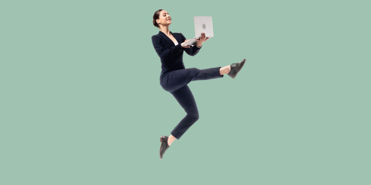 Jumping girl with laptop